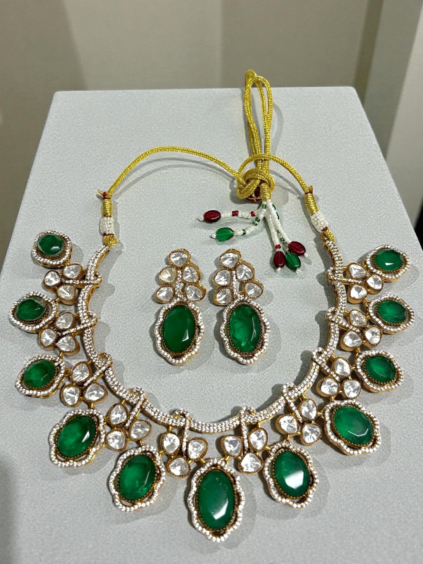 Inayah عناية Gold Plated Tyaani Kundan Set with Emerald Doublet Stone in Green