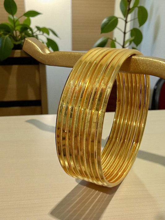 Heavyweight Metal Bangles in Yellow Gold